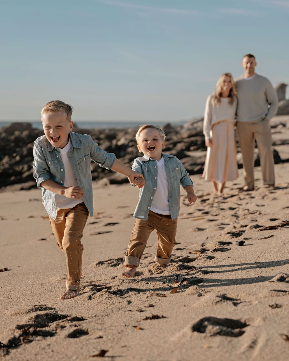 Candid beach photography sequence showing playful moments on sandy shores with ocean backdrop.