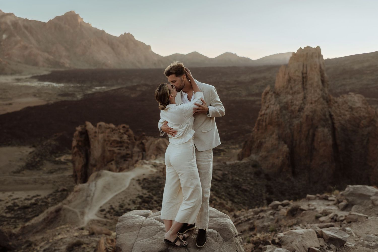 A black and white photo collage shows three intimate couples about to kiss in romantic poses.