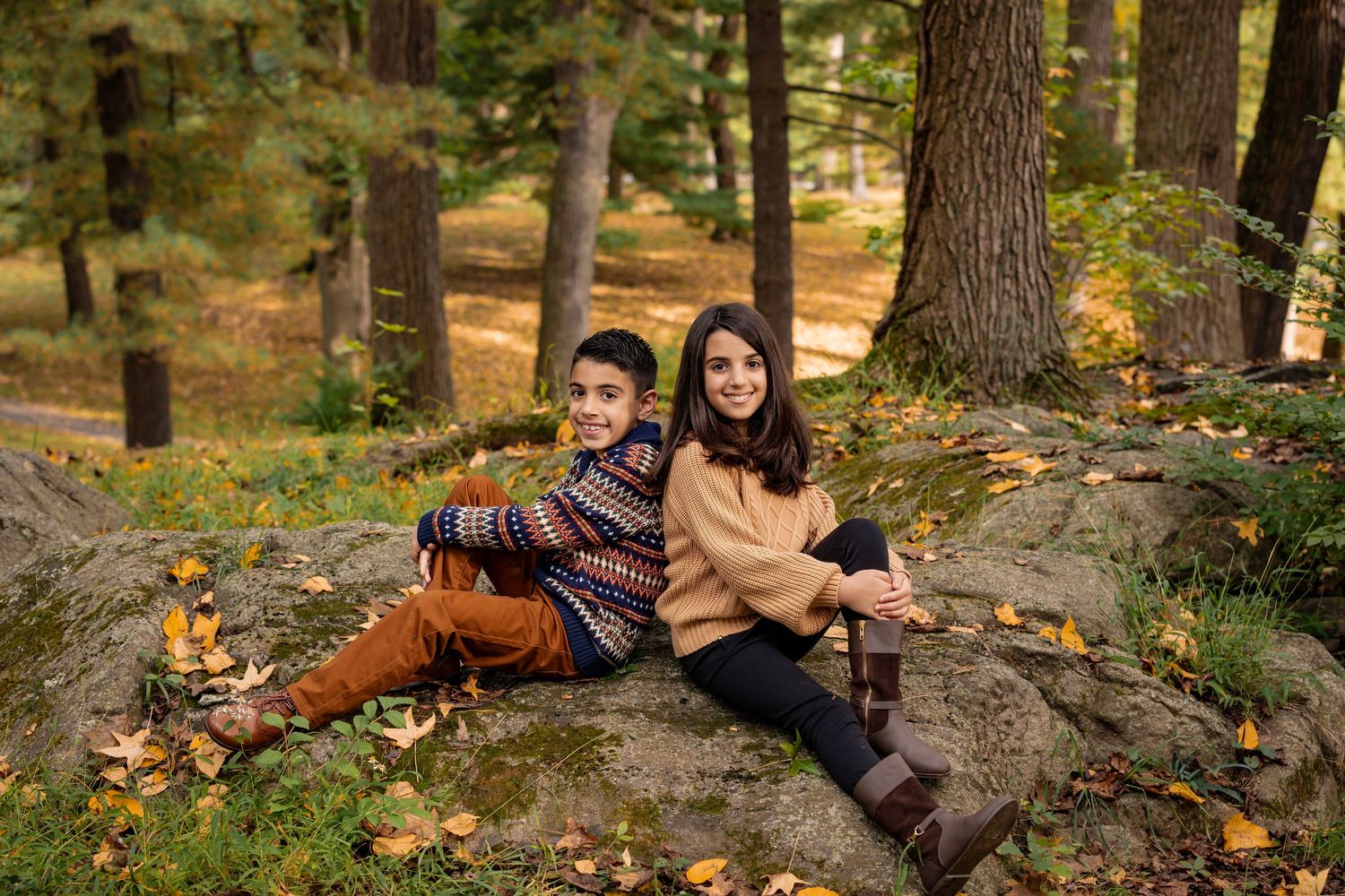 A sequence of autumn forest portraits shows someone in cozy layers posing thoughtfully among fallen leaves and trees.