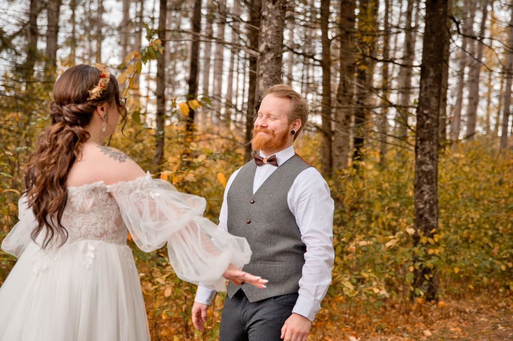 Fall wedding photography session capturing romantic moments among colorful autumn trees.