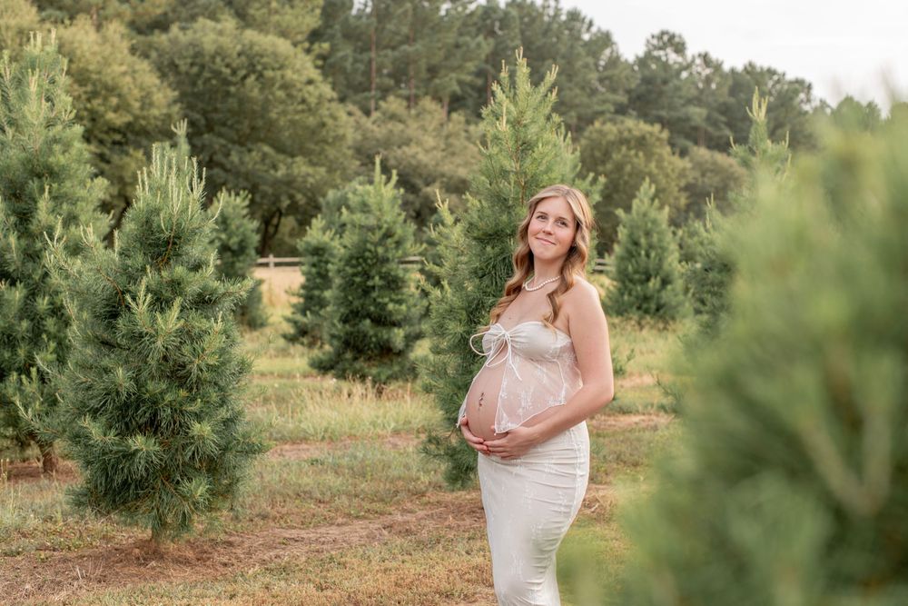 Maternity portrait among Christmas Trees at Cedar Ridge Tree Farm in Gilbert, SC.