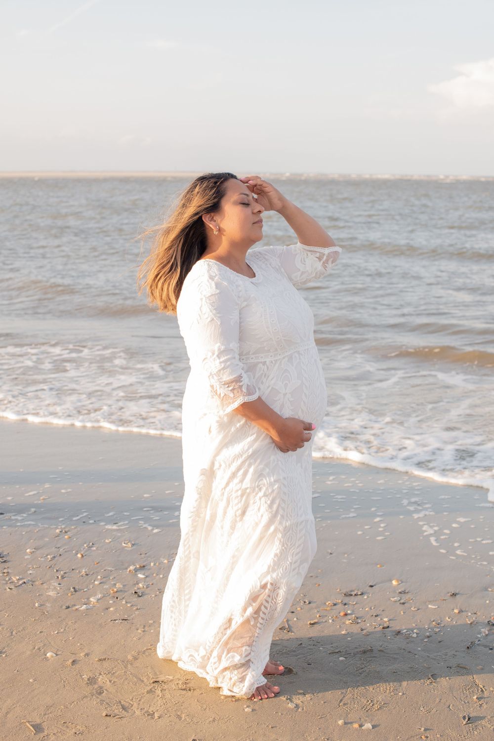 Maternity portrait by the ocean at Morris Island by Folly Beach.