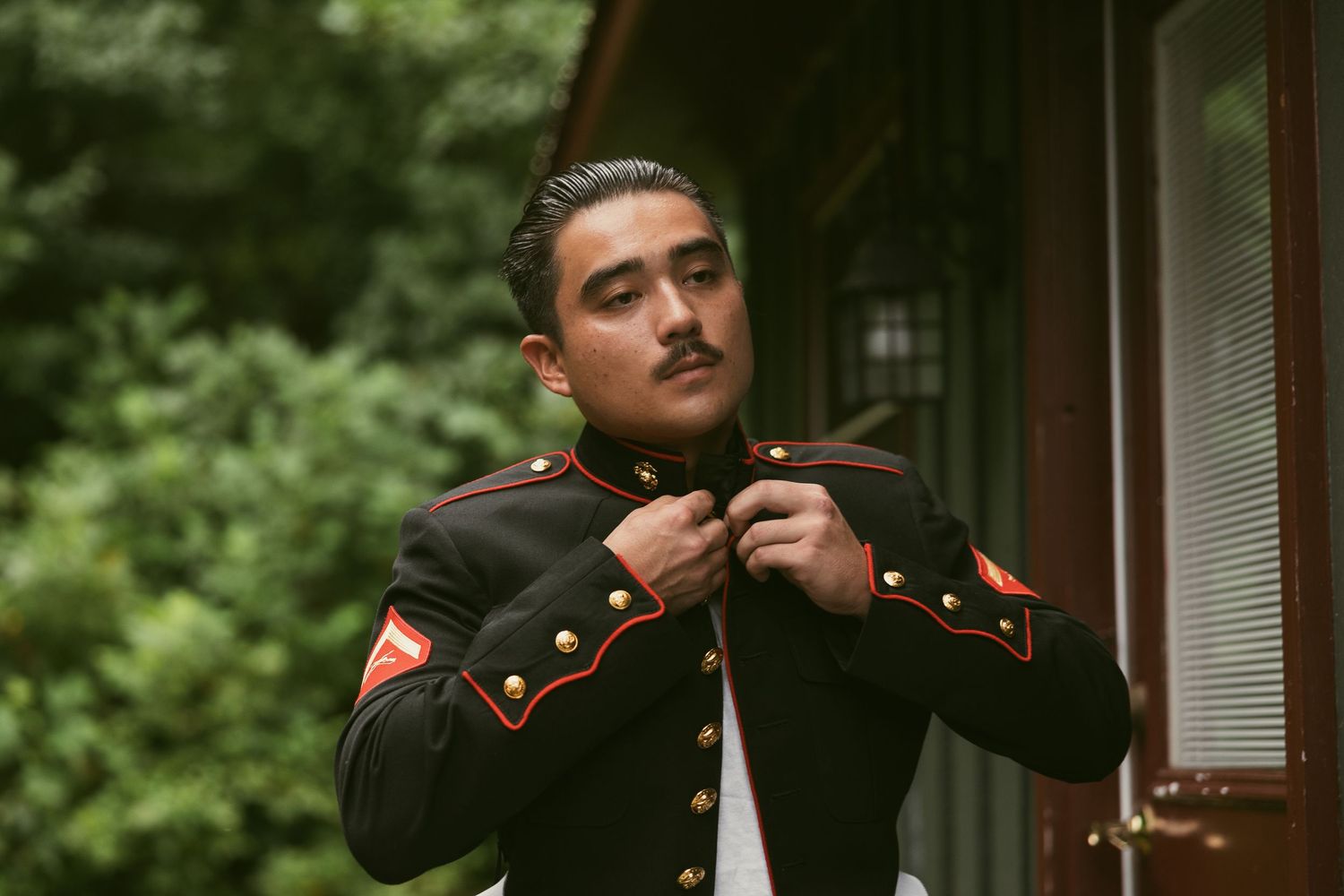 Military service members in dress uniforms at a formal event.