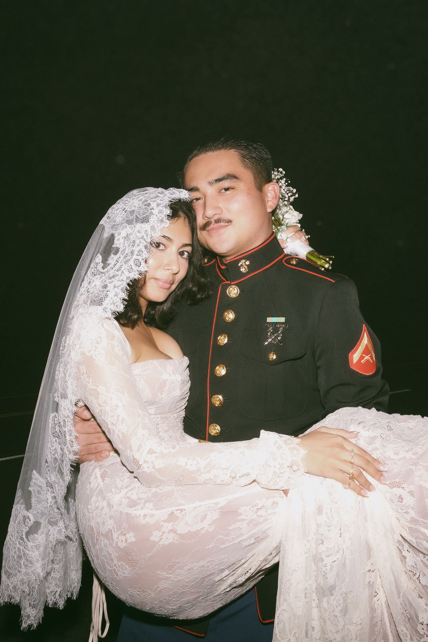 Artistic wedding portraits captured against a dark background.