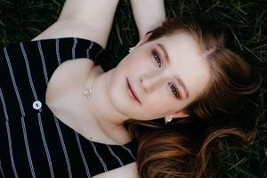 Portrait photo series showing multiple closeup shots of someone with long brown hair wearing a striped top.