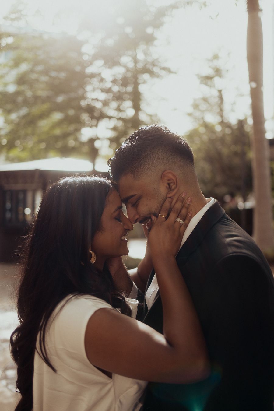 Cinematic South Florida couple kiss, Instagram-ready engagement portrait perfect for weddings and Pinterest boards by MannyPortraits.