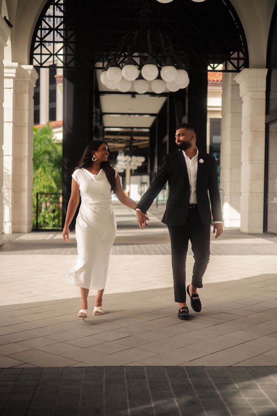 Romantic Miami engagement shoot under arches, Pinterest-worthy wedding inspiration styled for Instagram couples by MannyPortraits.
