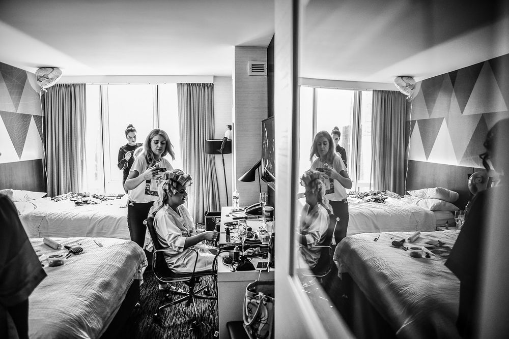 A sequence of black and white photos showing activity in a hospital room during childbirth and labor.