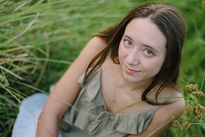 A series of outdoor portrait shots in a grass field on a sunny day.