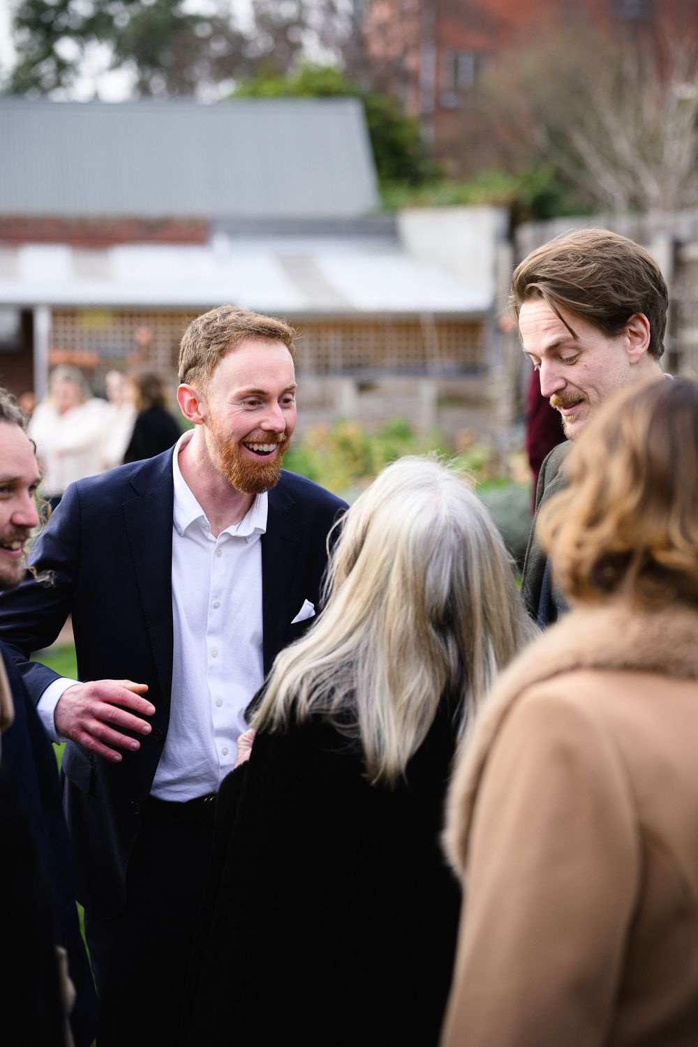 A progressive sequence of photos showing people engaged in lively conversation at an outdoor gathering.