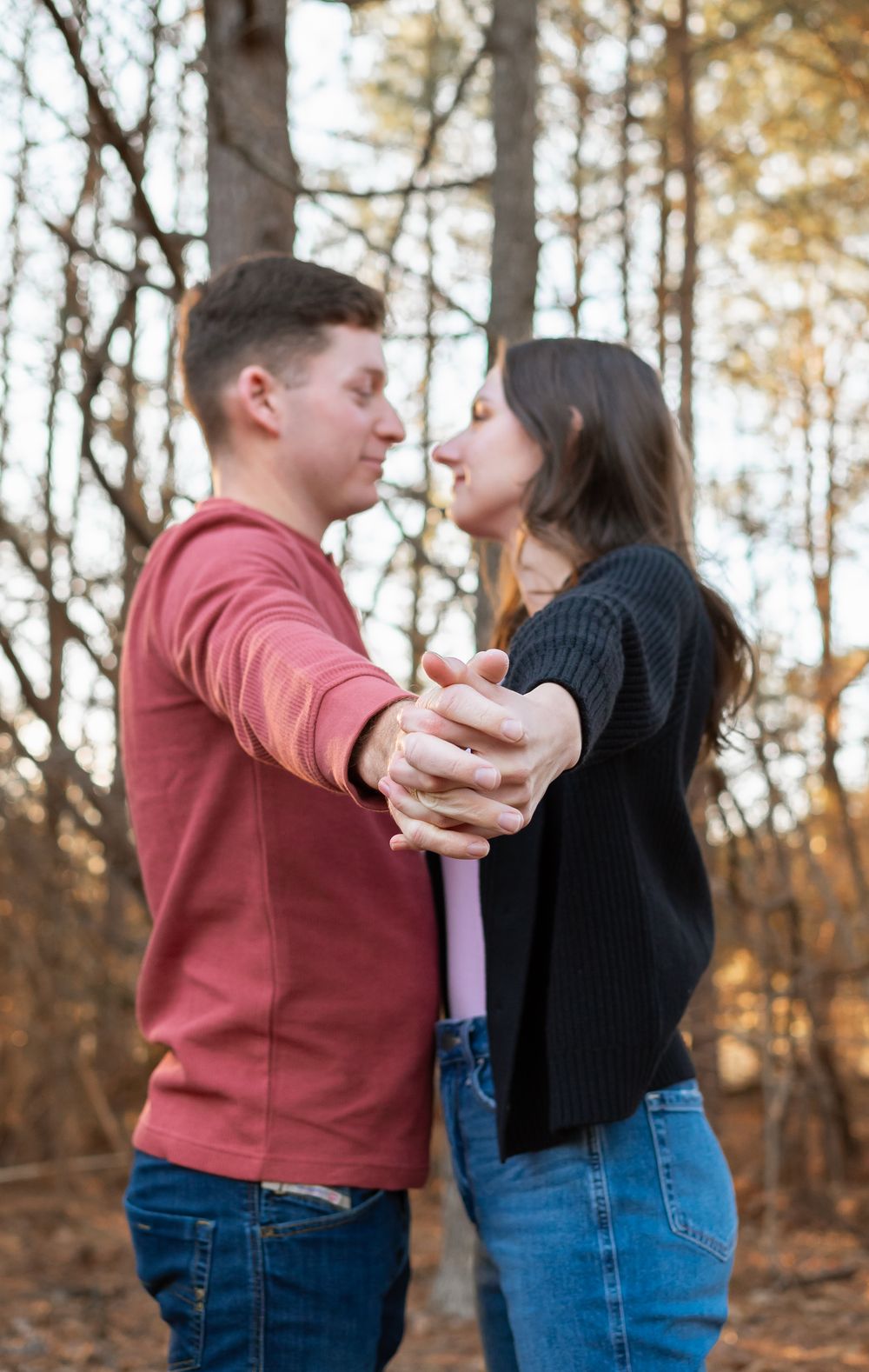 couple extending held hands for a photo session