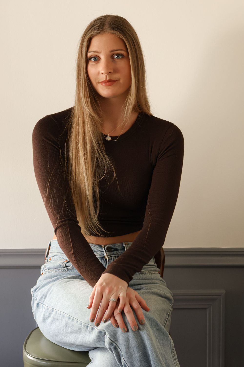 Lifestyle portraits featuring casual poses in modern casual wear against a minimalist setting.
