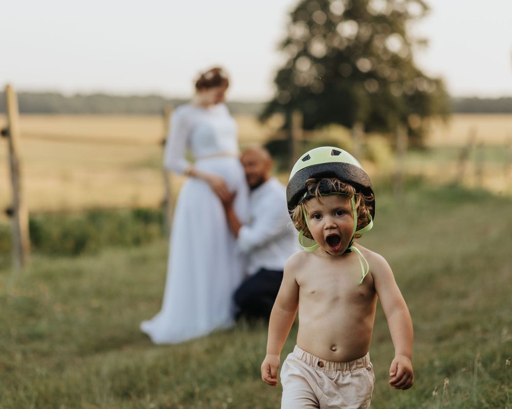 Bride and groom holding hands during countryside sunset – wedding photographer Luis Gomes in Cambridgeshire