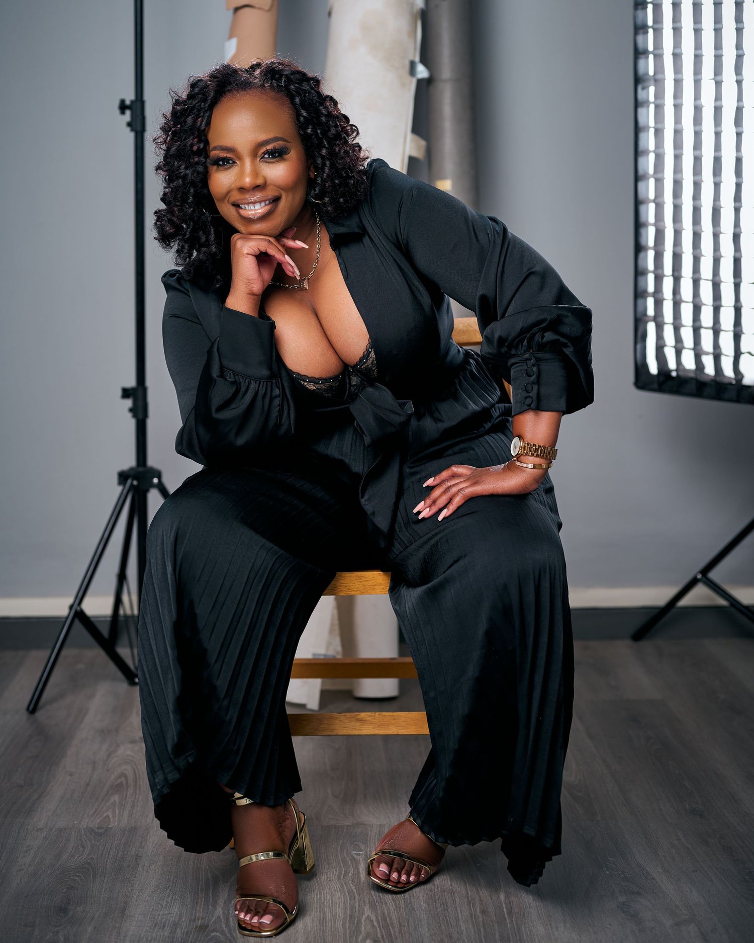 a lady wearing black posing