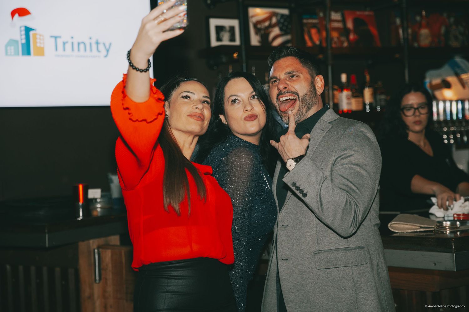 People enjoying themselves at a lively bar or restaurant gathering.