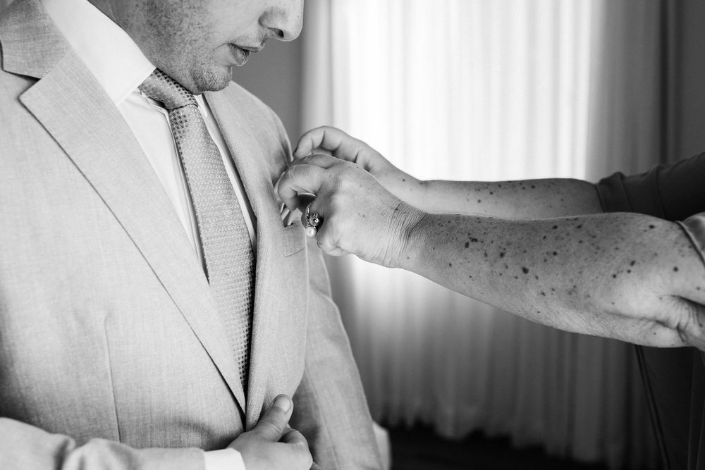 Close-up black and white shot of wedding preparation details.