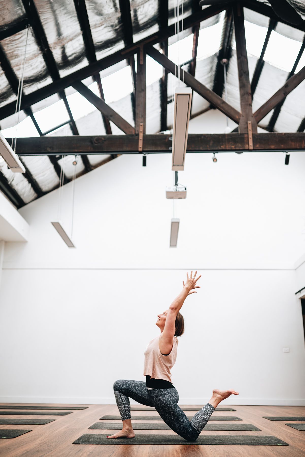 Yoga instructor doing stretches in a yoga studio during a professional branding photo session with Melbourne branding Photographer