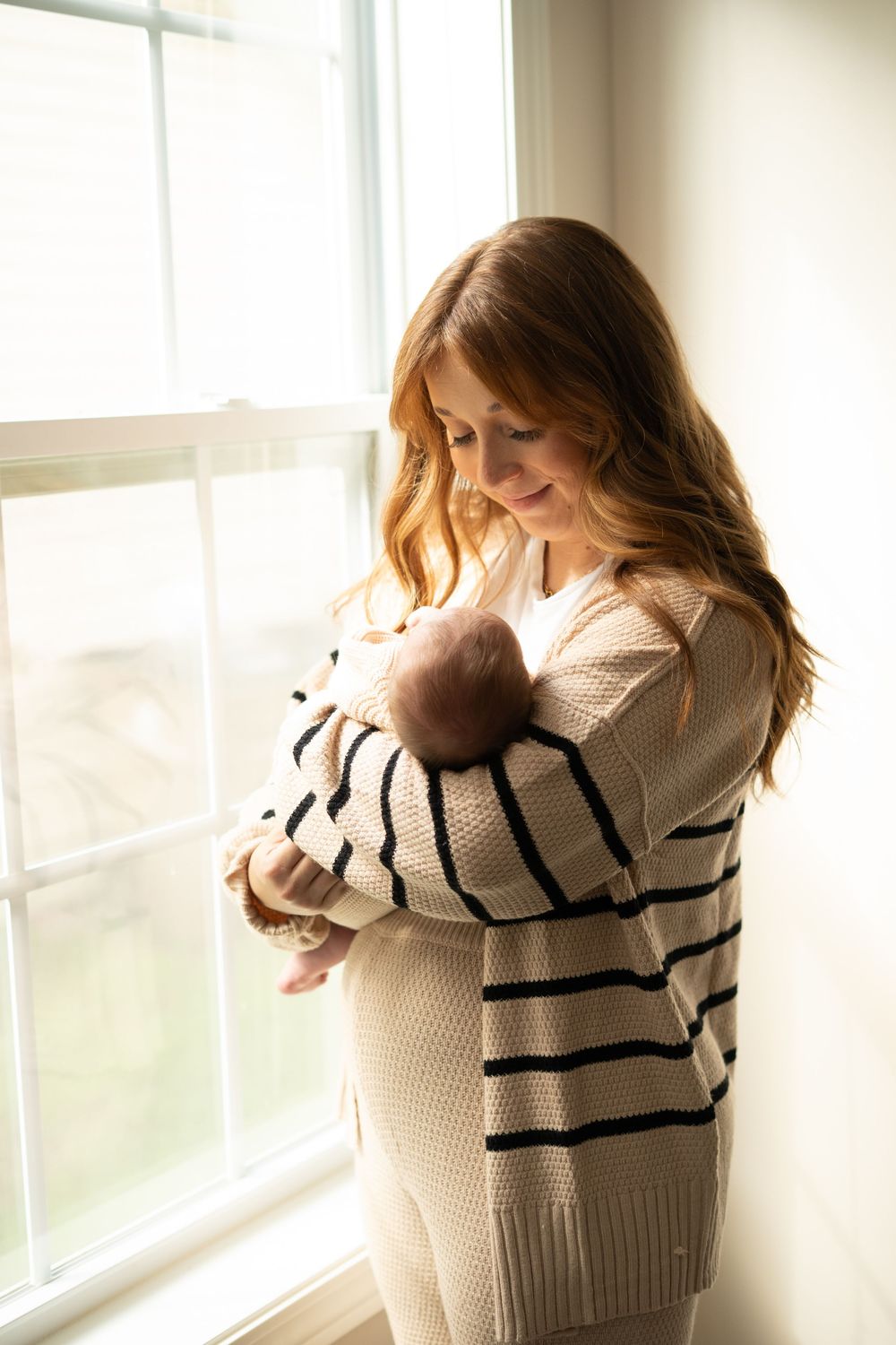 A person wearing a beige striped sweater stands near a sunlit window in a sequence of intimate portrait shots.