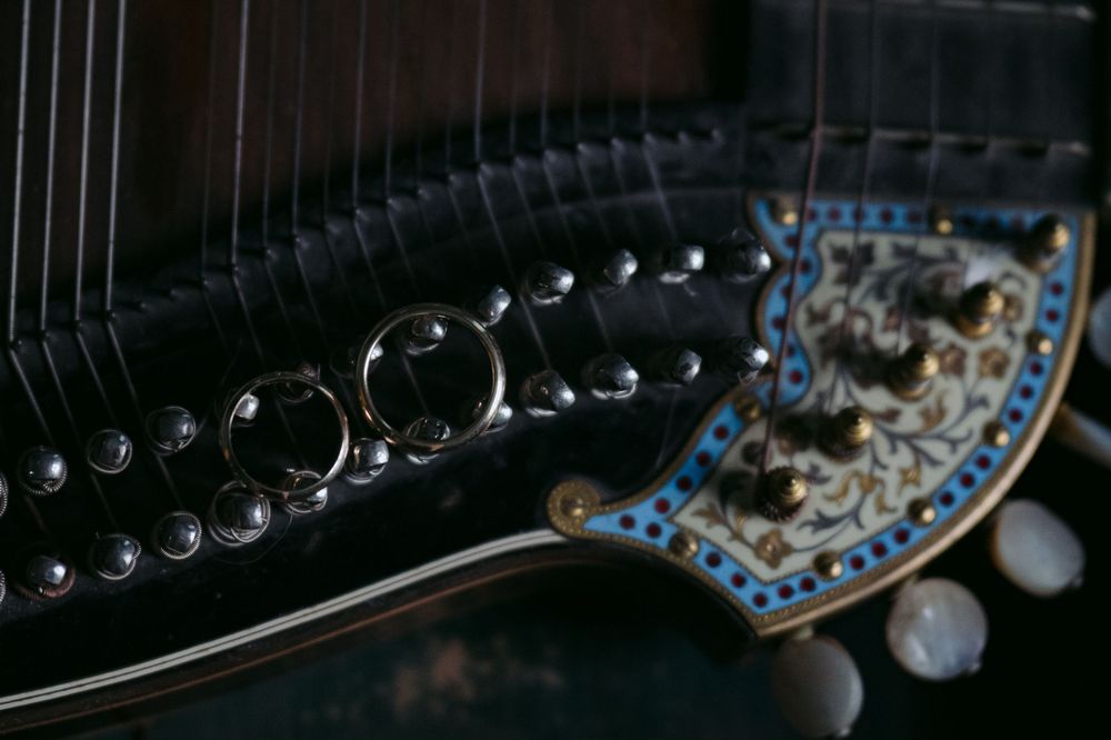 Close-up macro photograph of a circuit board with electronic components and soldered connections in dark lighting.