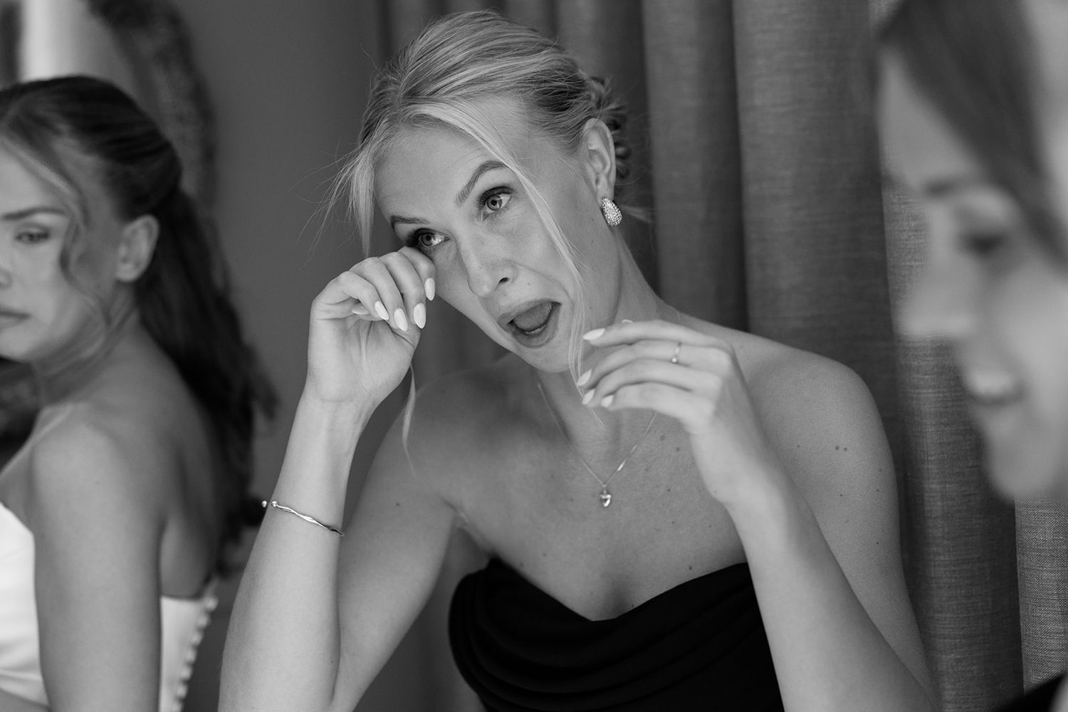 A series of black and white portraits showing emotional expressions and gestures in a cinematic style.