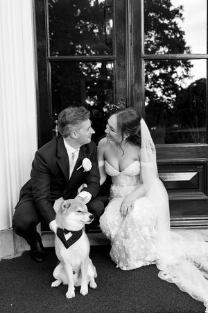 A wedding couple poses with their white cat in a series of black and white photos.
