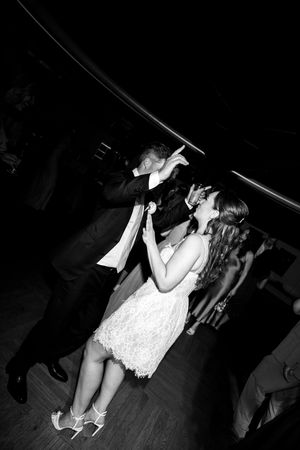 A romantic dance sequence captured in dramatic black and white lighting.