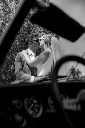 Romantic black and white wedding photos captured through decorative window frames.