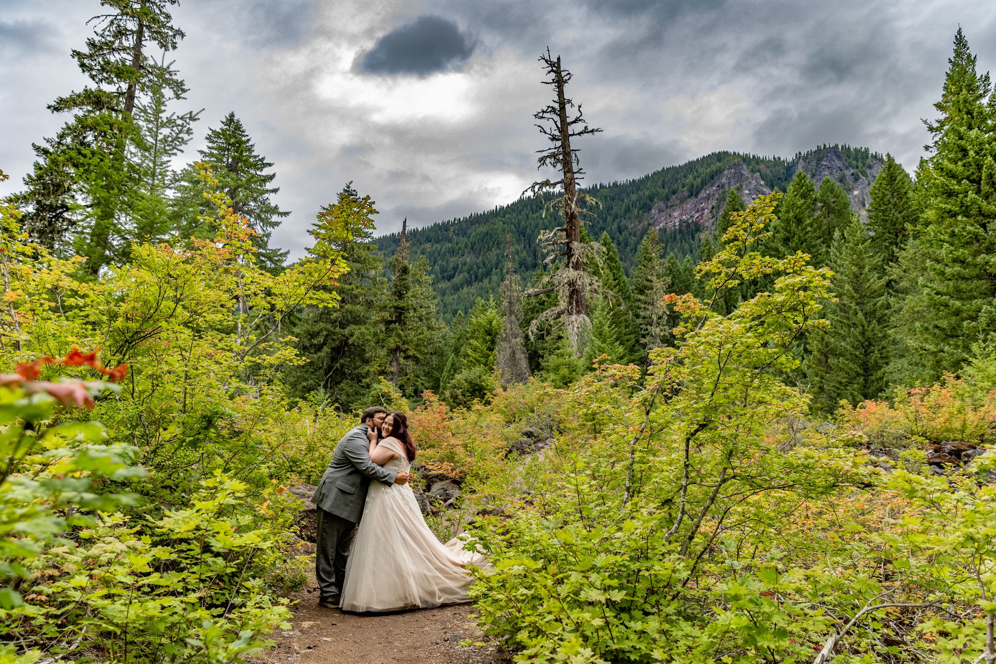 Couple sharing a kiss after their elopement in the Willamette National Forest, PNW Elopement Photographer.