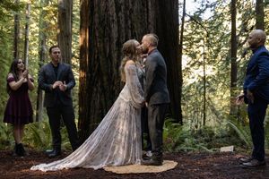 Couple Sharing their first kiss during their elopement ceremony in the California Redwoods. Adventure Elopement Photographer.