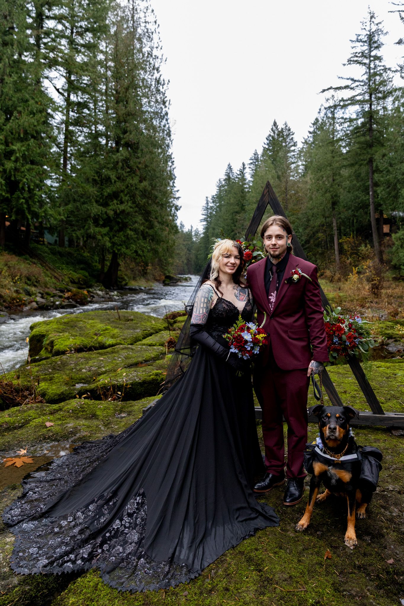 Bride and groom in front of their micro wedding alter on East Fork Lewis River in Battleground Washington. PNW Elopement Photographer.