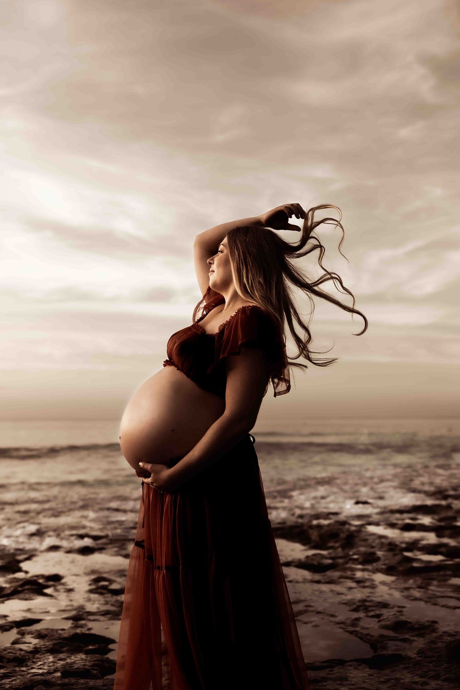 Maternity Photograph- Jervis Bay NSW- Pregnant women on natural rocks with the Jervis Bay sunset kissed skinshoalhaven Maternity photography