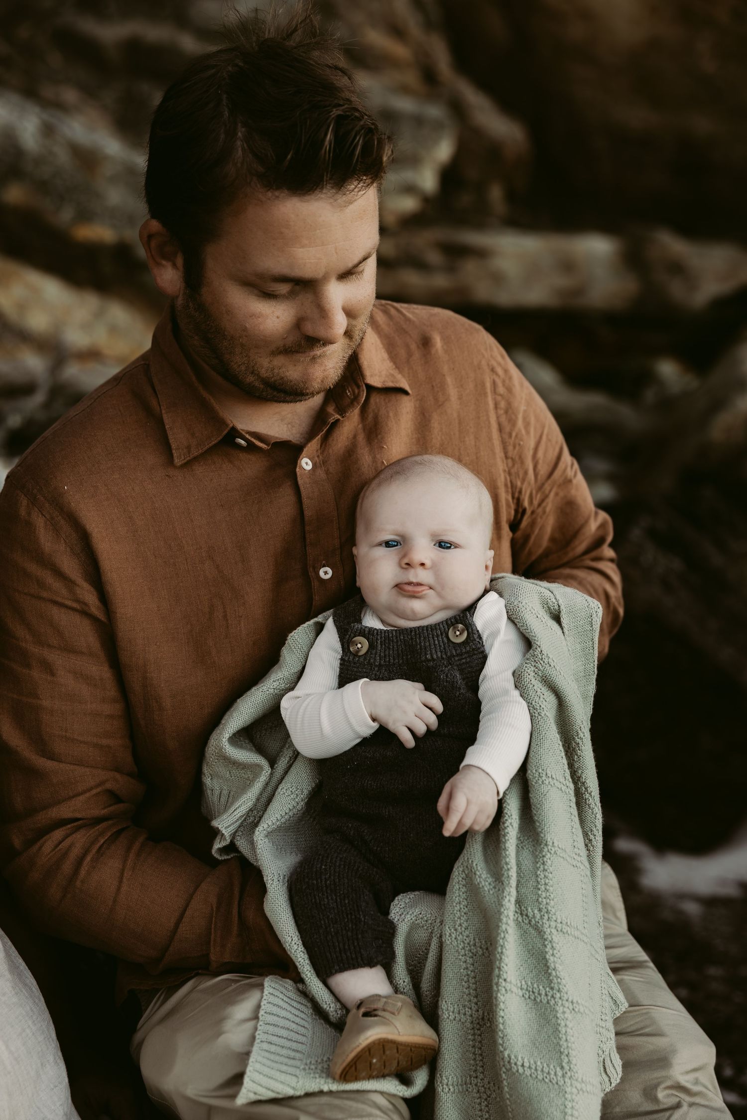 Newborn photography-On location- Jervis Bay-Vincentia-Shoalhaven-dad-holds-baby-in-arms-on-the-beach