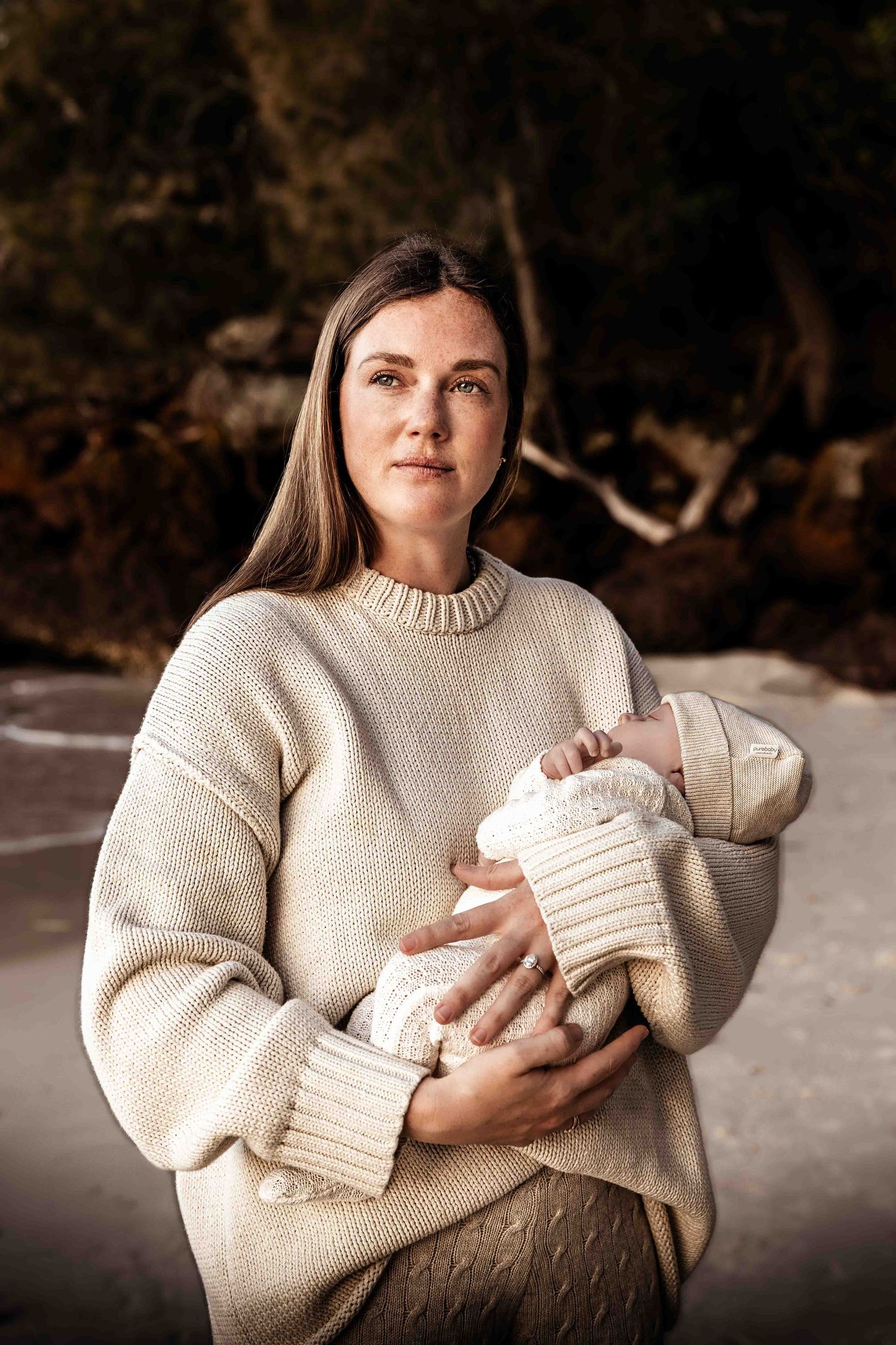 Newborn photography-On location- Jervis Bay-Vincentia-Shoalhaven-Mum-holds-baby-in-arms-on-the-beach
