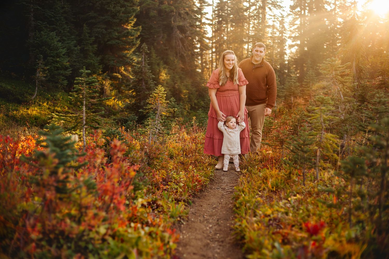 Family walking together during their adventure and family photoshoot at Mt. Rainier National Park near Seattle, Washington