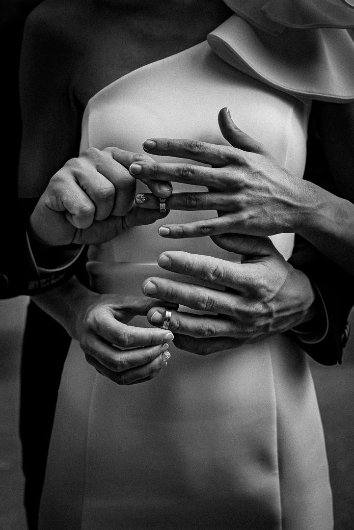 Black and white artistic photo series showing hands gracefully moving across a torso in an abstract dance-like sequence.