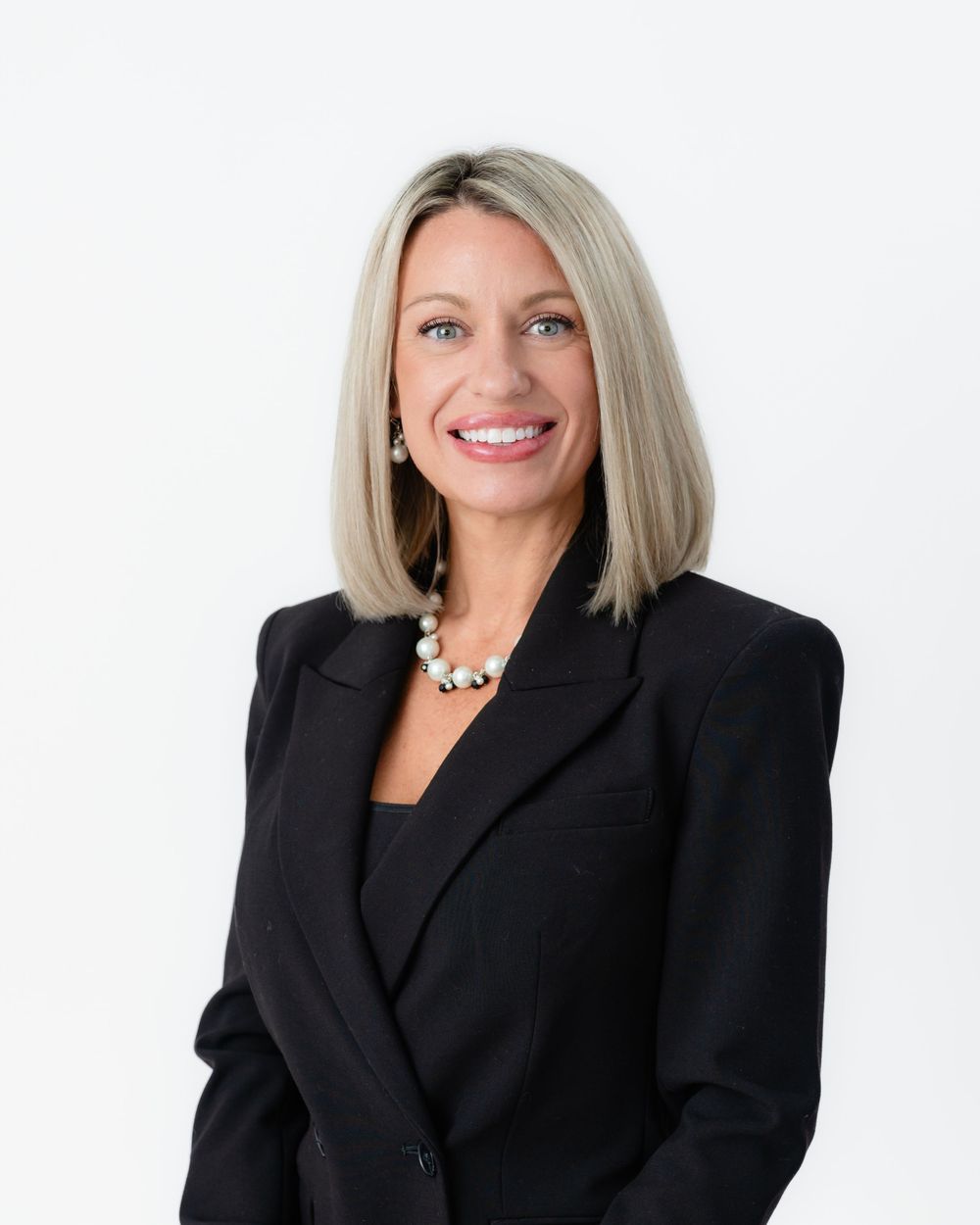 Professional headshots of a person in a black blazer against a white background.