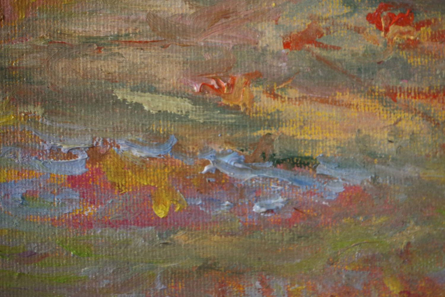 Abstract expressionist painting showcasing vibrant swirls of blue, pink, orange and green paint in dynamic brushstrokes.