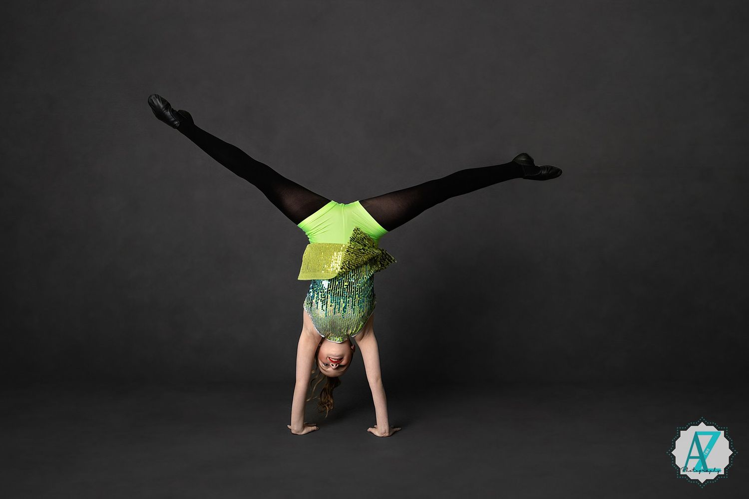 A sequence of six photos showing someone performing a cartwheel gymnastic move across a dark studio space.