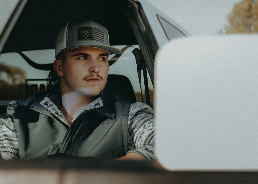 Senior Portrait showing view through car window while driving - Warsaw, Indiana