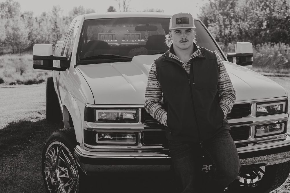 Black and white senior portrait of customized truck with chrome accents and aftermarket wheels - Warsaw, Indiana
