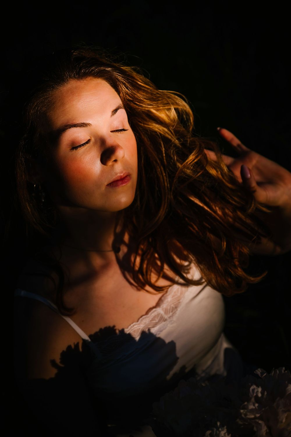 A dramatic portrait series shows a person with flowing hair against a dark background in moody lighting.
