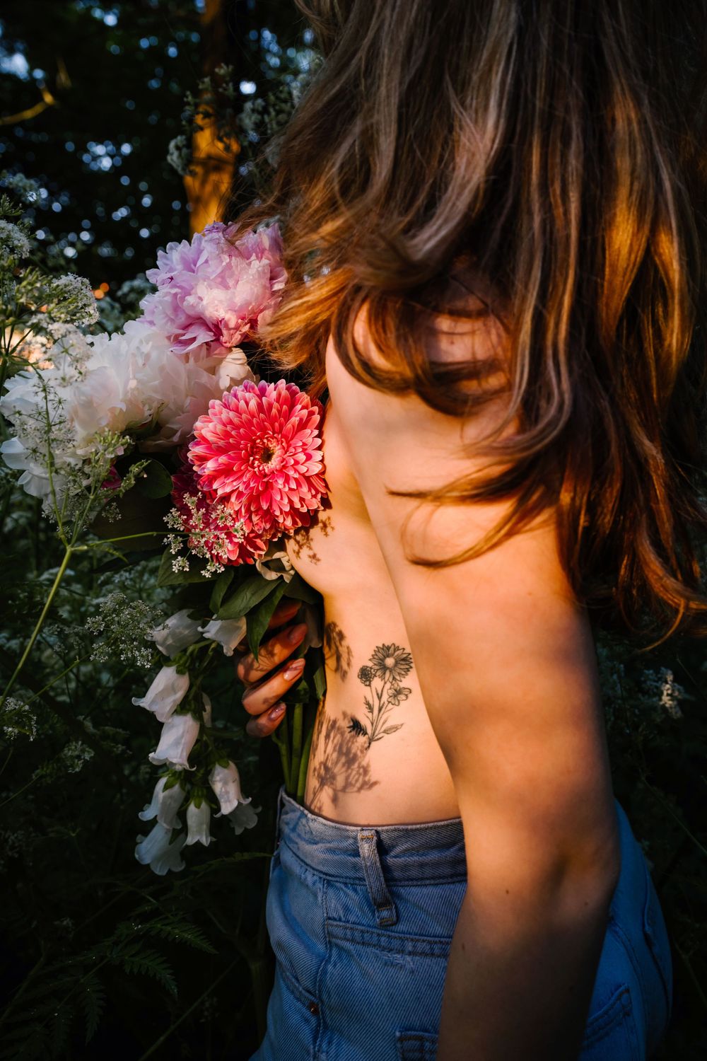 A series of subtle side-profile portraits showing pink flowers against dark blue denim in natural lighting.