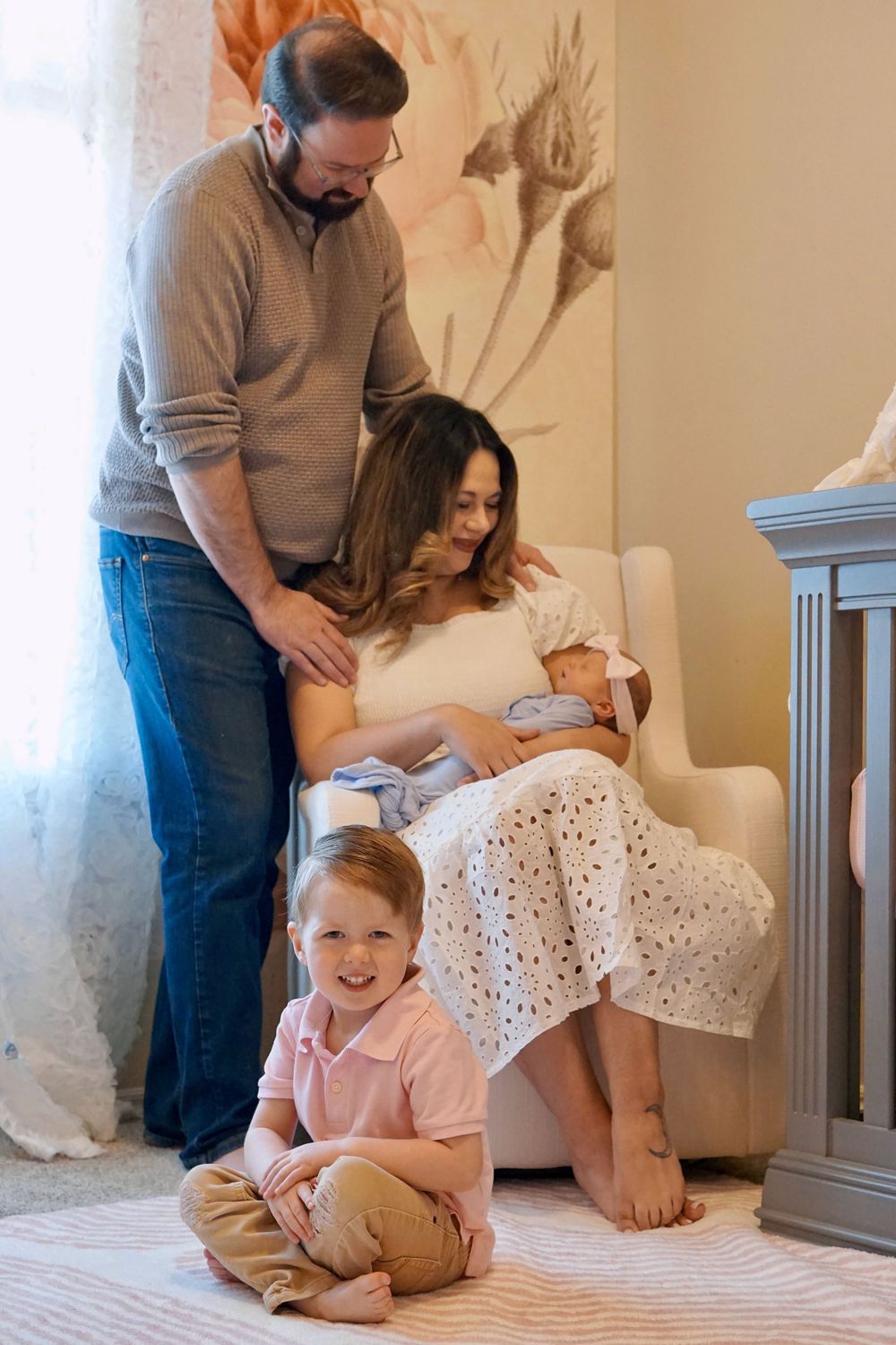 Family members sitting together on a white bed showing progression of emotional moments in four connected frames.