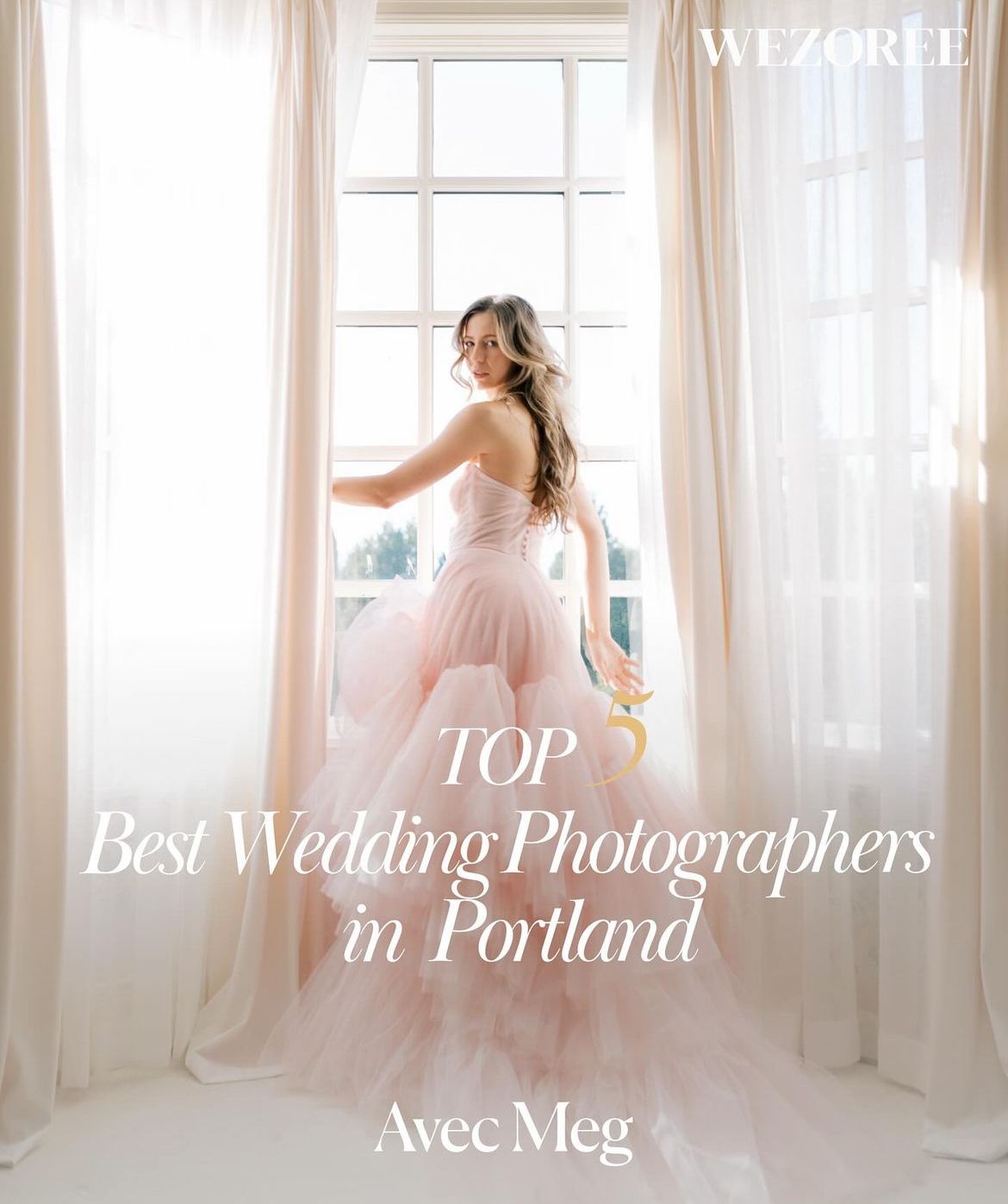 A figure in a flowing pink tulle gown poses gracefully by a sunlit window with white curtains.