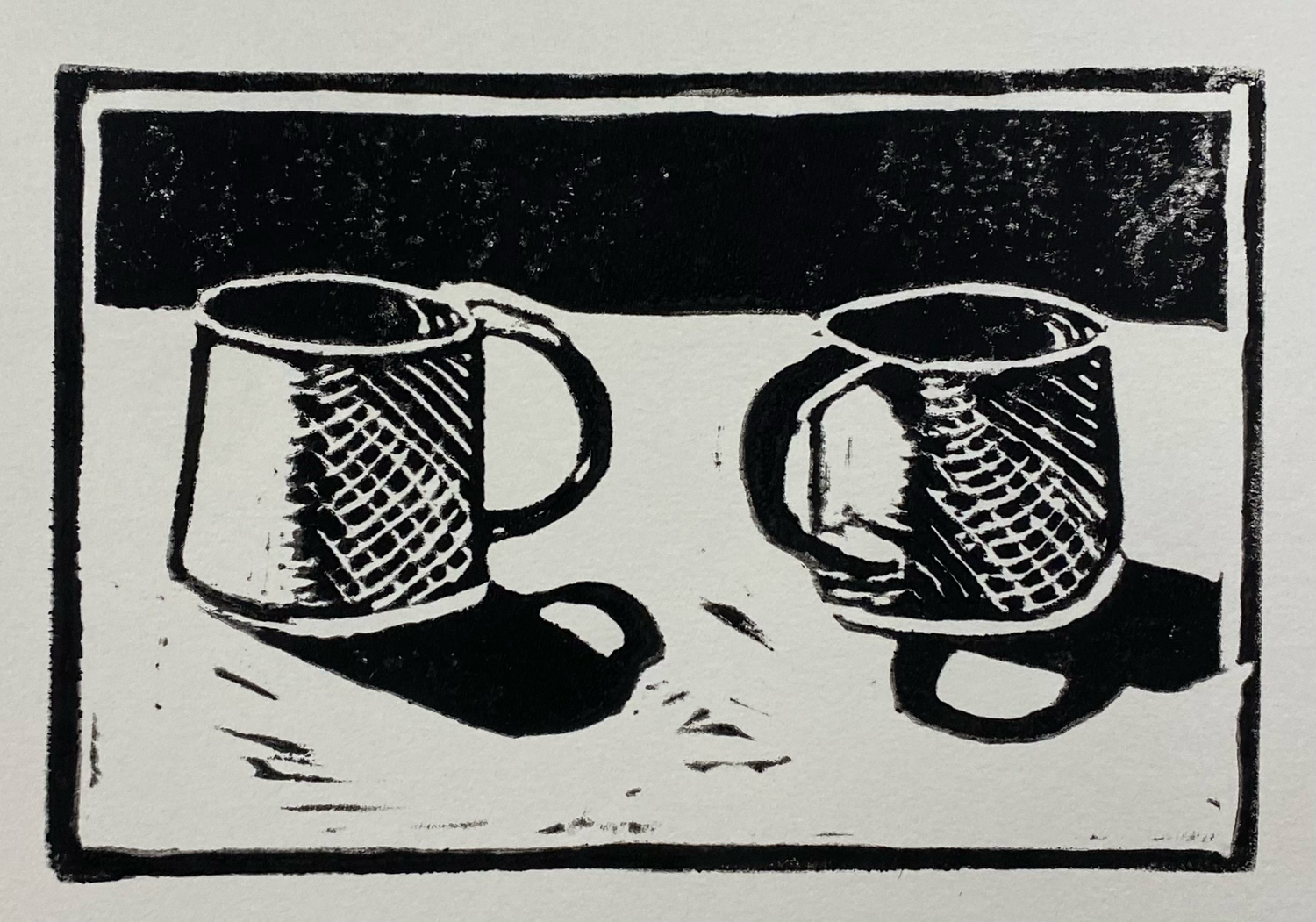 Black and white woodcut illustration of two coffee mugs casting shadows on a table.