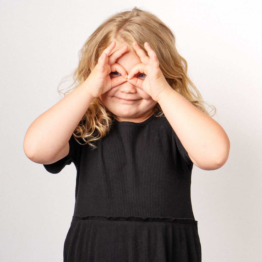 Blonde little girl making silly face for portrait session taken by East Tennessee children's photographer