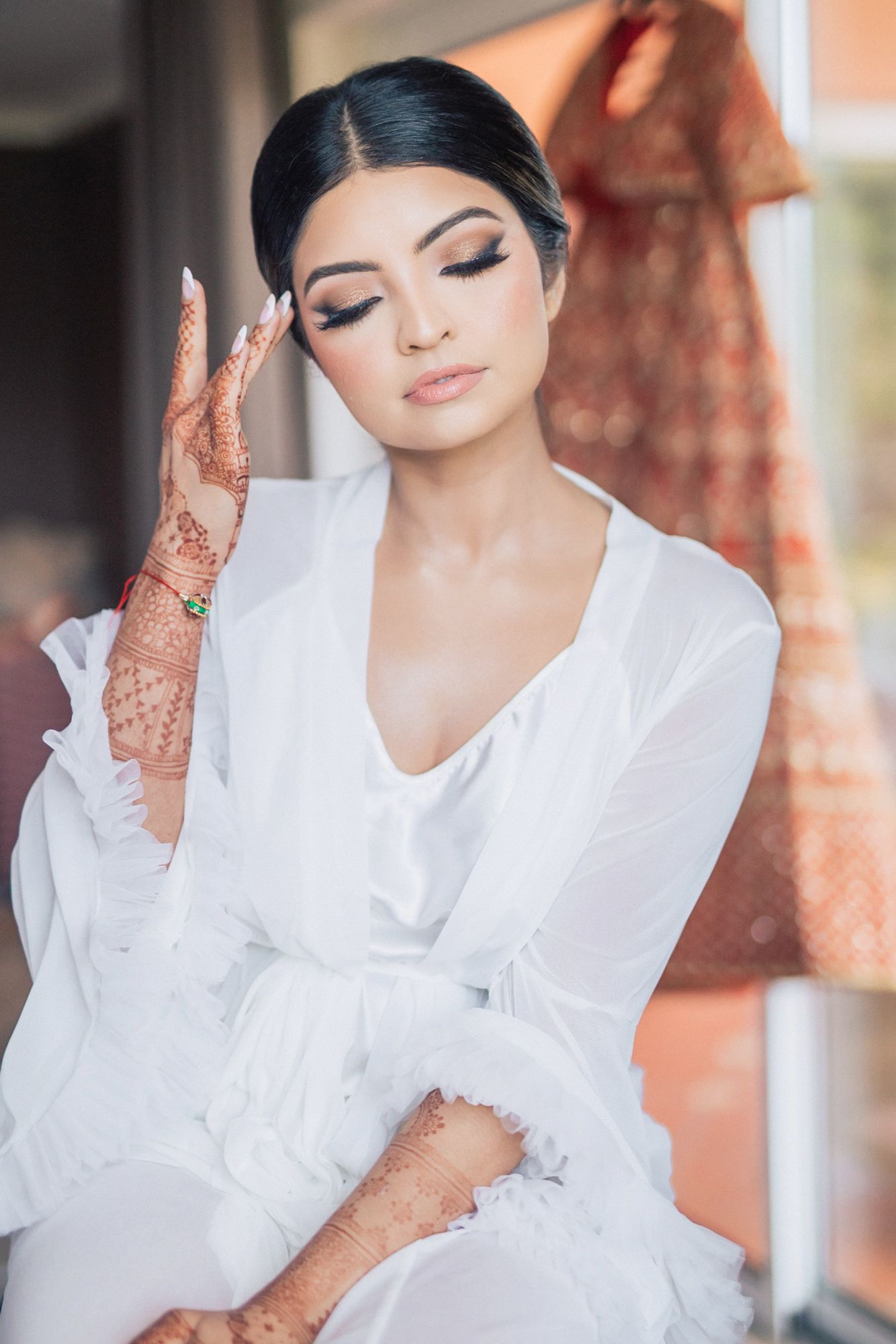 The bride getting ready for her Destination Indian Wedding in Portugal at Penha Longa Resort