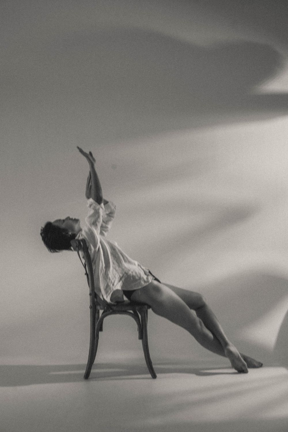 Dynamic black and white dance sequence showing graceful movements across the frame.