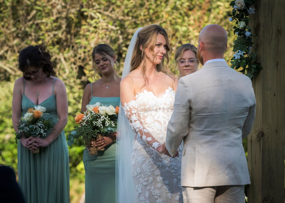 A group photo montage of people at a formal outdoor event with dresses and formal wear in natural sunlit setting.