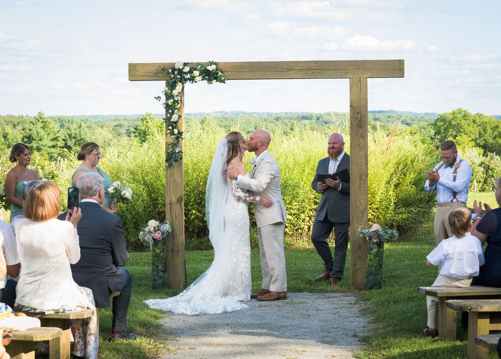 A series of wedding ceremony photos showing an outdoor wooden arbor and people gathered in a rustic natural setting.